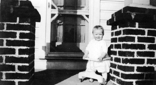 Joellen in front of her home in Zebulon.