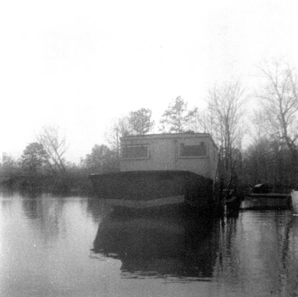 Boat behind store.